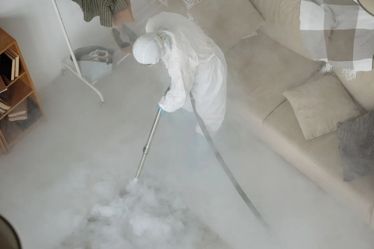 Biohazard cleanup technician in protective equipment, Edgewood, Dallas, TX